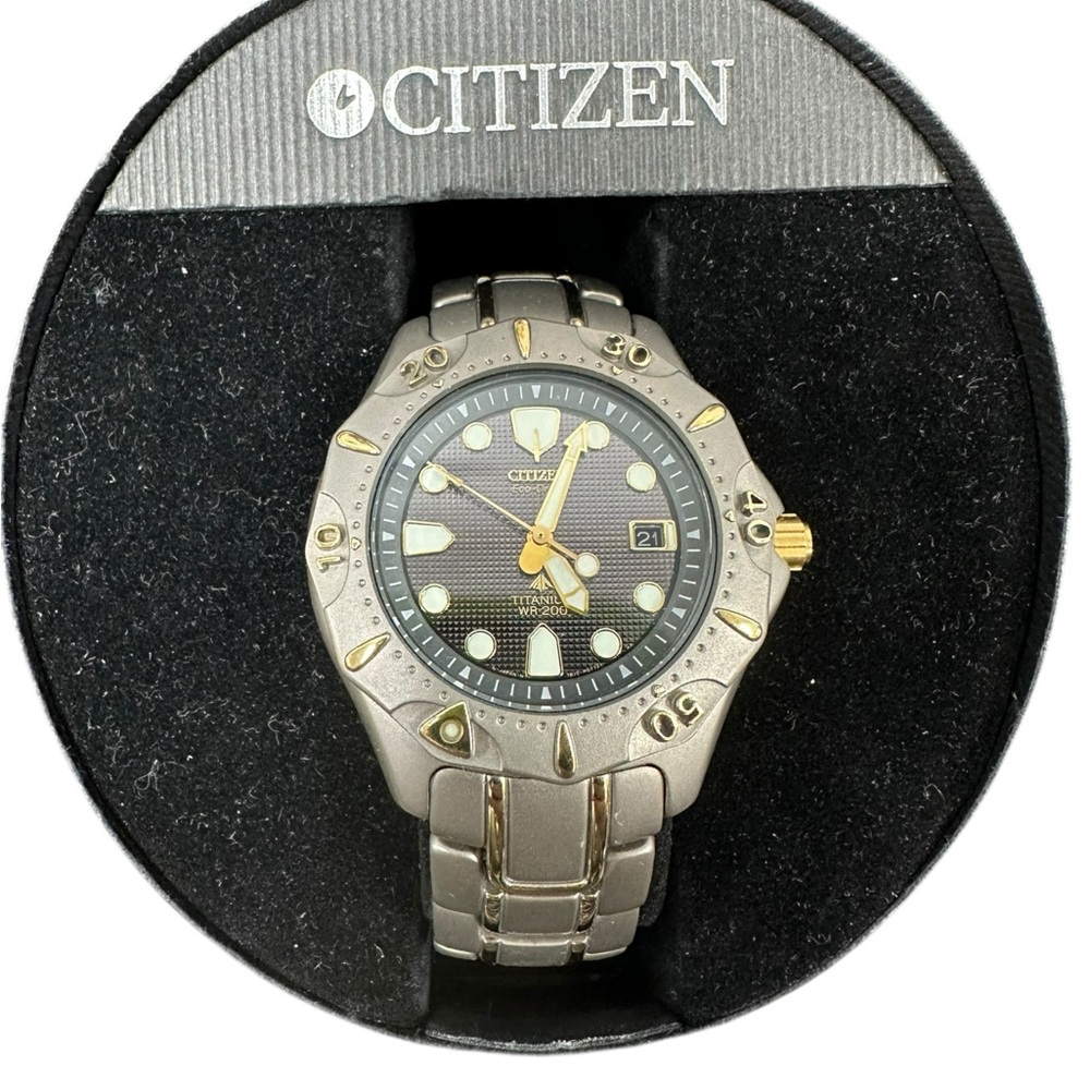 Citizen Men's Silver and Gold Accent Watch